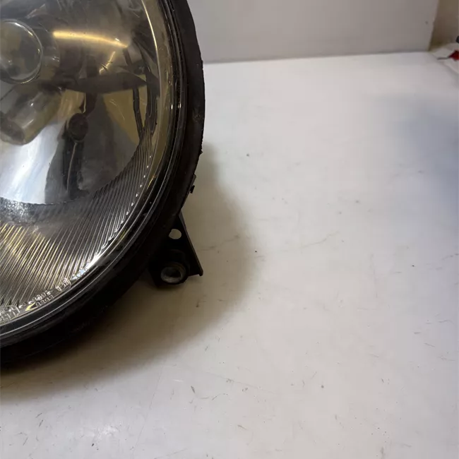 Proiettore con regolatore altezza sinistro