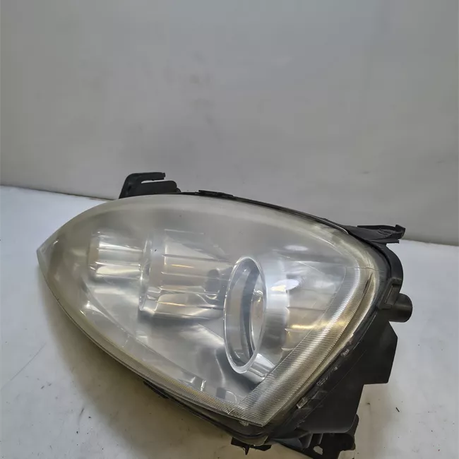 Proiettore sinistro t. 64000001>