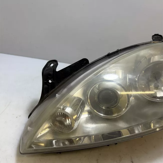 Proiettore sinistro t. 53000001>